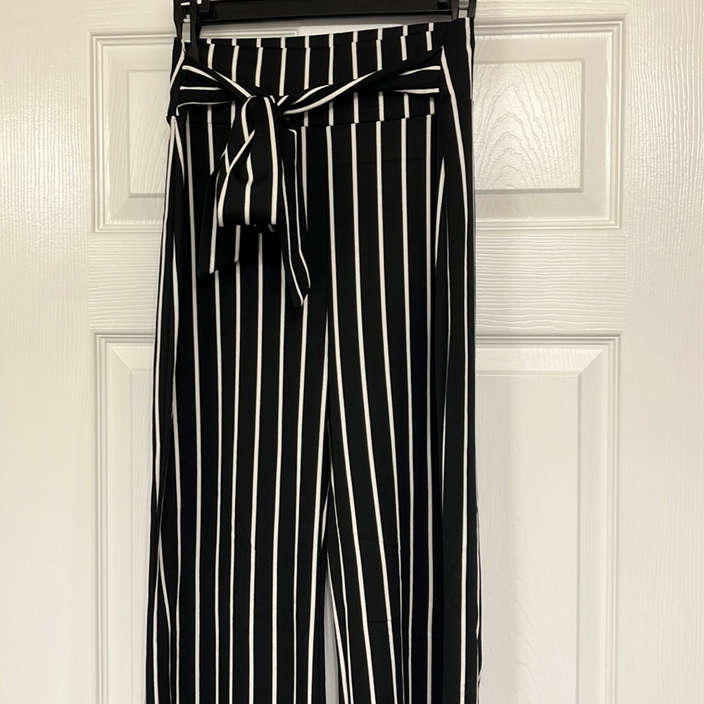 Worn once Windsor black and white striped pants with tie in size M.